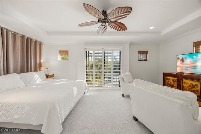 bedroom with access to exterior, ceiling fan, a raised ceiling, and light colored carpet