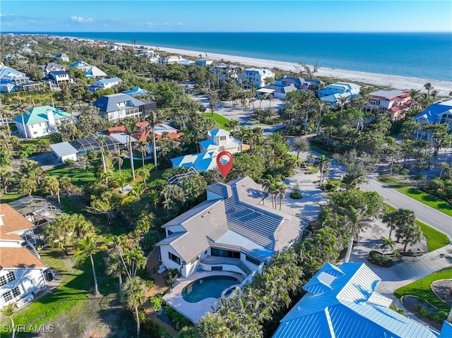 bird's eye view with a beach view and a water view