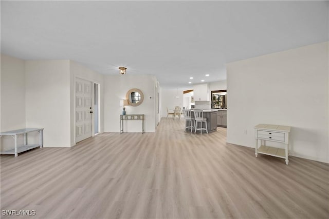 unfurnished living room with light hardwood / wood-style floors