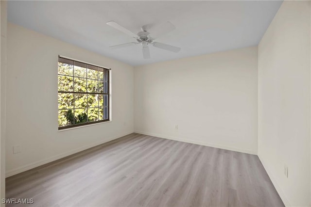 spare room featuring ceiling fan and light hardwood / wood-style floors