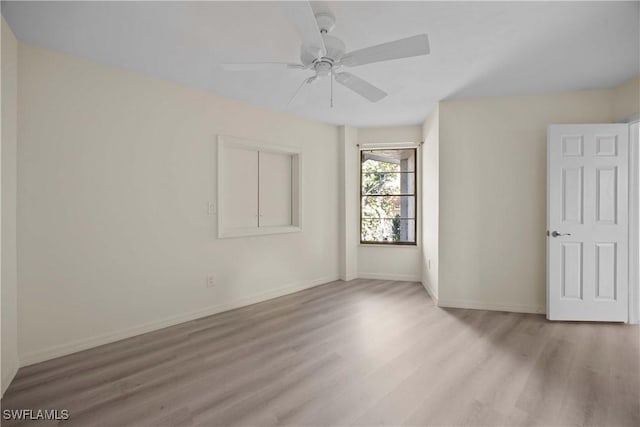 unfurnished room with light hardwood / wood-style flooring and ceiling fan