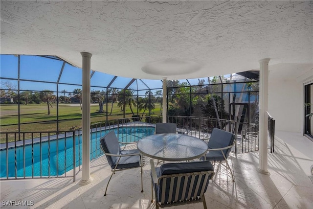 view of pool with a lanai and a patio area