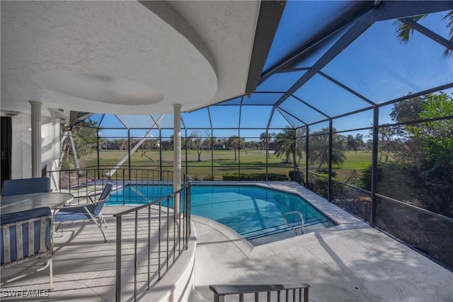 view of pool with a lanai and a patio area