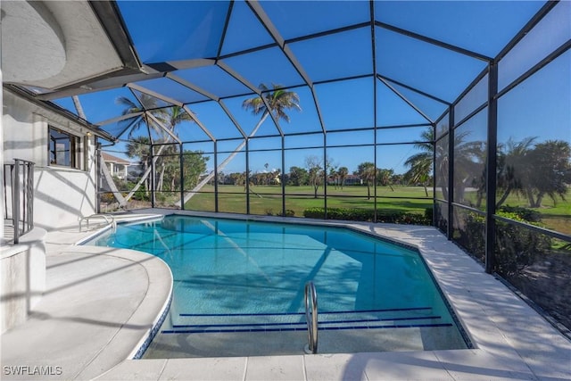 view of pool featuring a patio and glass enclosure