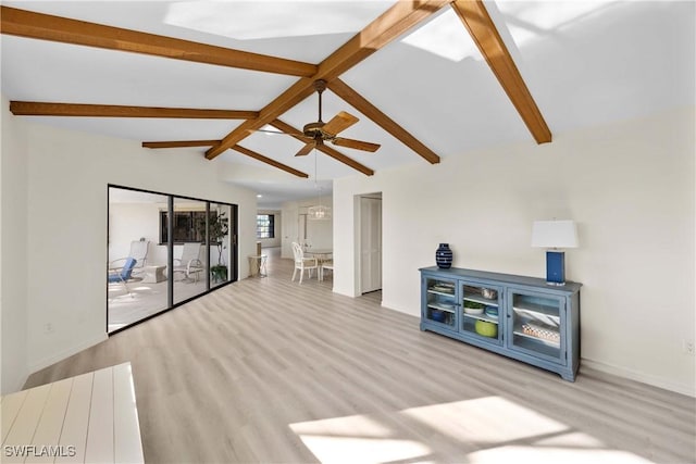 living room featuring ceiling fan, lofted ceiling with beams, and light wood-type flooring