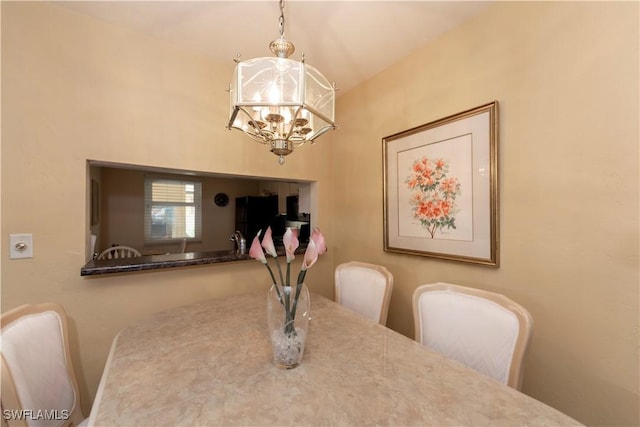 dining area featuring a chandelier