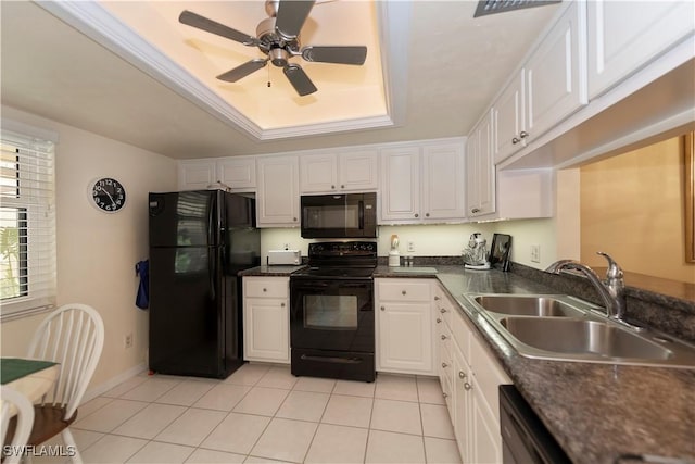 kitchen featuring a raised ceiling, ceiling fan, sink, black appliances, and white cabinets