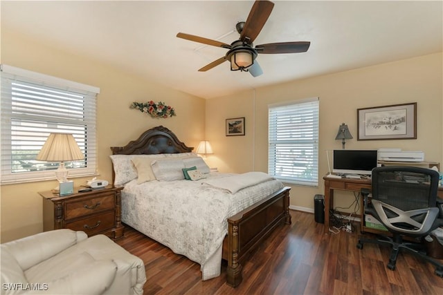 bedroom with dark hardwood / wood-style floors and ceiling fan