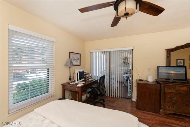 bedroom with ceiling fan and dark wood-type flooring