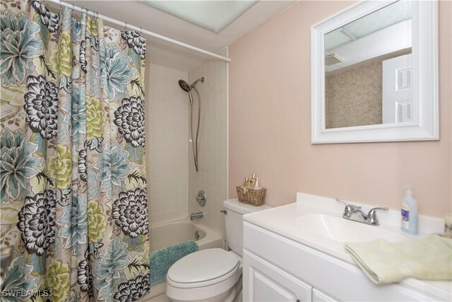 full bathroom with vanity, toilet, and shower / bath combo with shower curtain