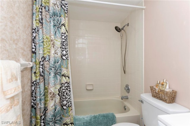 bathroom with shower / bathtub combination with curtain and toilet