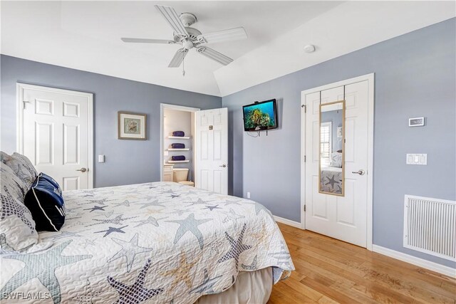 bedroom with light wood-type flooring and ceiling fan