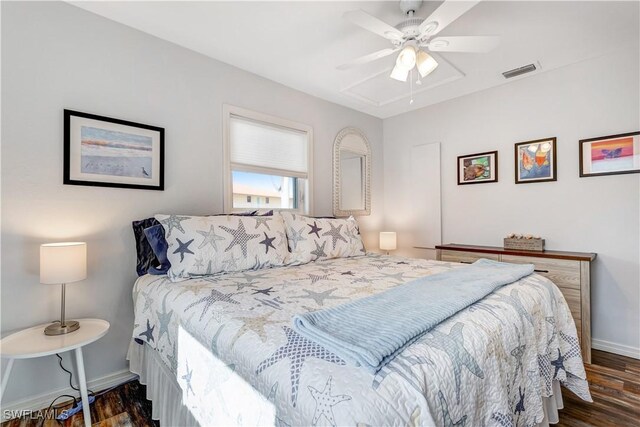 bedroom featuring ceiling fan and dark hardwood / wood-style floors