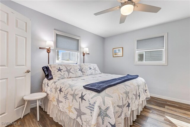 bedroom with ceiling fan and wood-type flooring