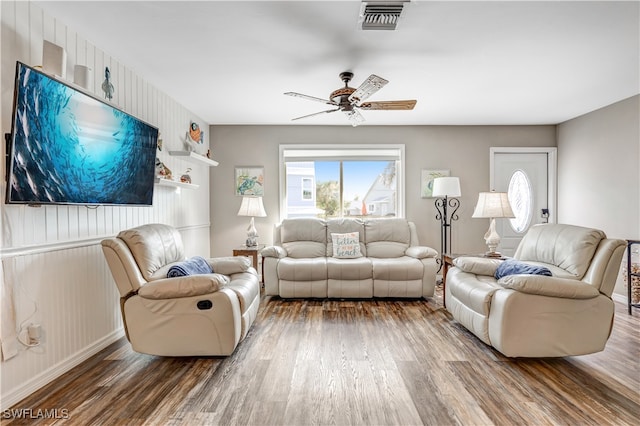 living room with hardwood / wood-style flooring and ceiling fan