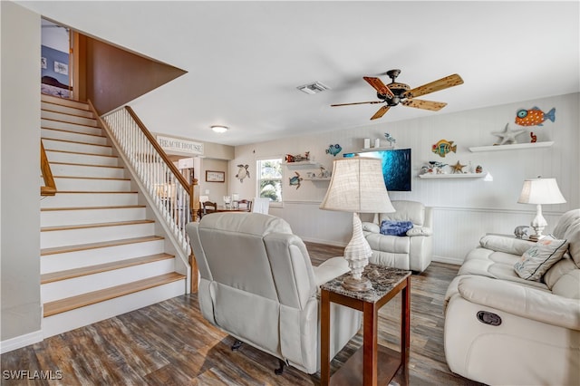 living room with ceiling fan and dark hardwood / wood-style flooring