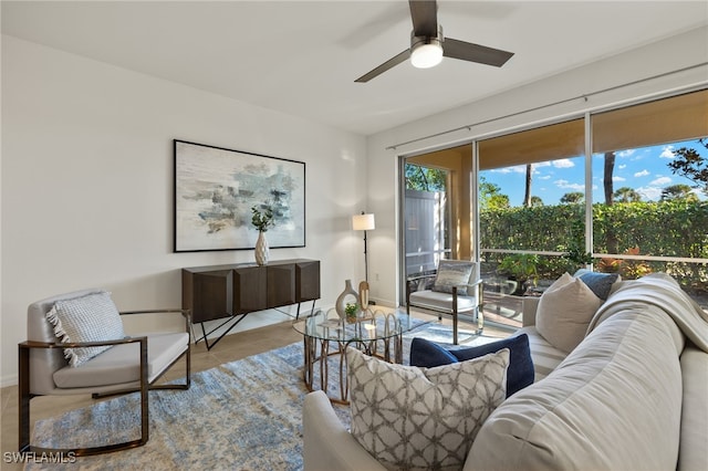 living room with ceiling fan and light tile patterned flooring