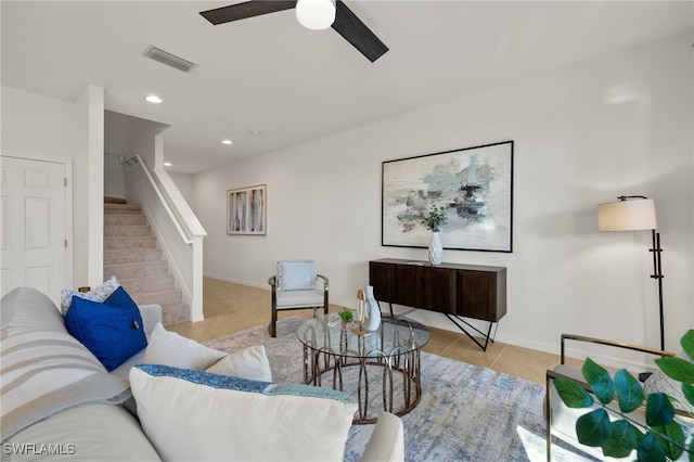 tiled living room with ceiling fan