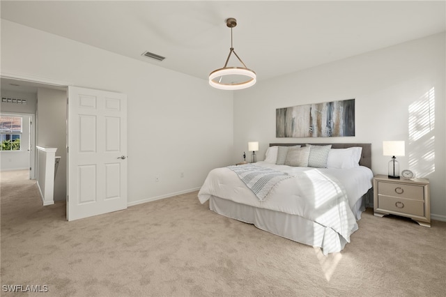 bedroom featuring light colored carpet