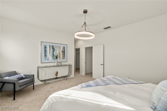 bedroom featuring light colored carpet