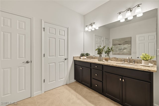 bathroom with tile patterned flooring and vanity