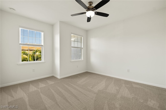 carpeted empty room with ceiling fan