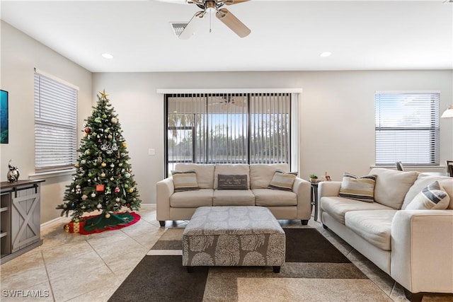 living room featuring light tile patterned floors, visible vents, baseboards, ceiling fan, and recessed lighting