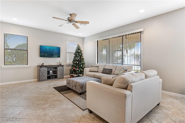 living room with light tile patterned floors and ceiling fan