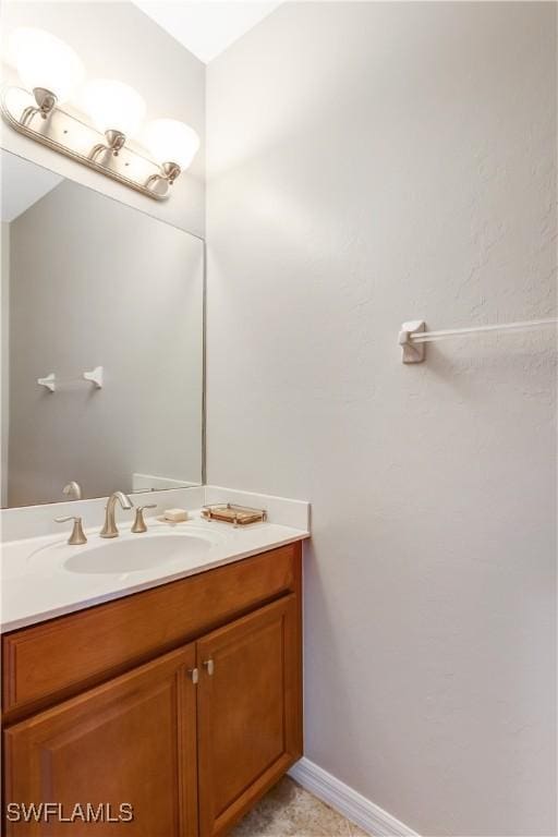 bathroom featuring vanity and baseboards