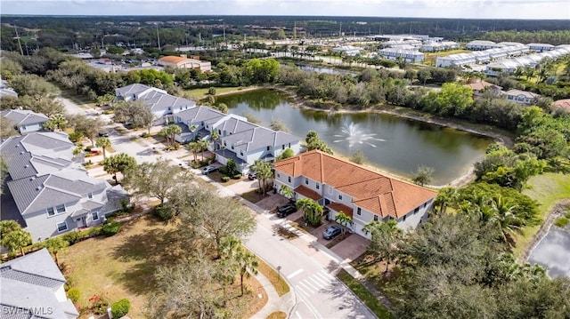 birds eye view of property with a water view and a residential view