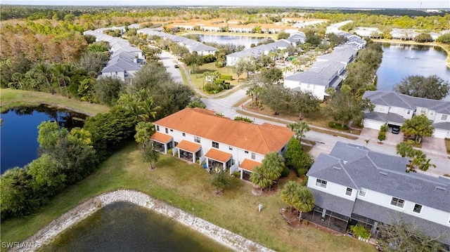 drone / aerial view with a water view