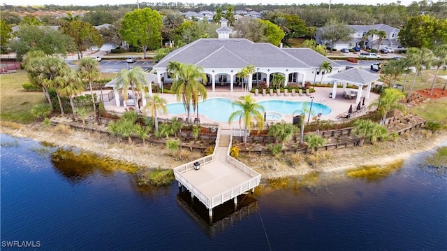 birds eye view of property with a water view