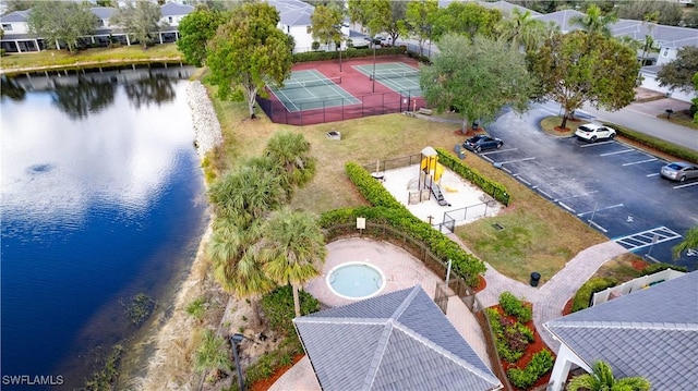 birds eye view of property with a water view