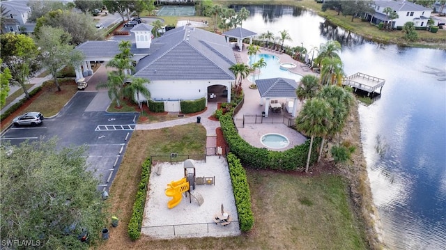 birds eye view of property with a water view