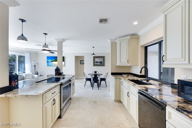 kitchen with cream cabinetry, stone counters, hanging light fixtures, and black appliances