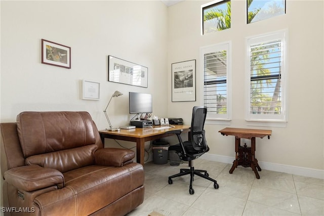 tiled office featuring a high ceiling