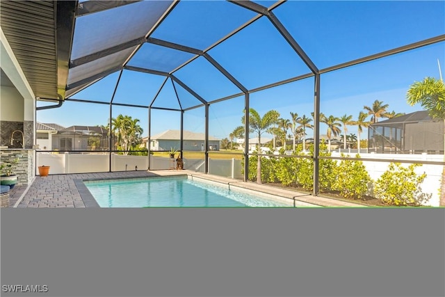 view of pool featuring a lanai and a patio