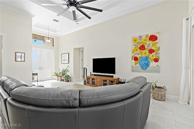 living room with french doors, a raised ceiling, crown molding, ceiling fan, and light tile patterned floors