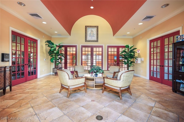 living area featuring french doors and ornamental molding