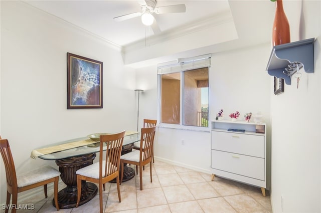 dining area featuring ornamental molding, light tile patterned flooring, and ceiling fan