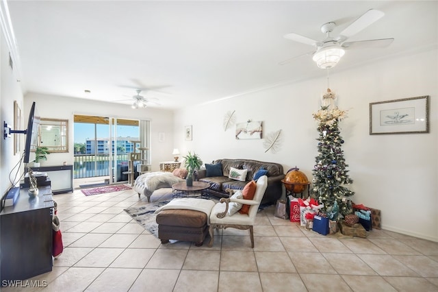 living room featuring ceiling fan and light tile patterned floors