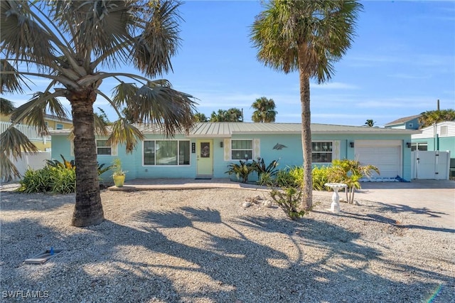 single story home featuring a garage