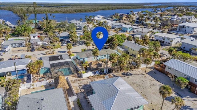 bird's eye view featuring a residential view and a water view