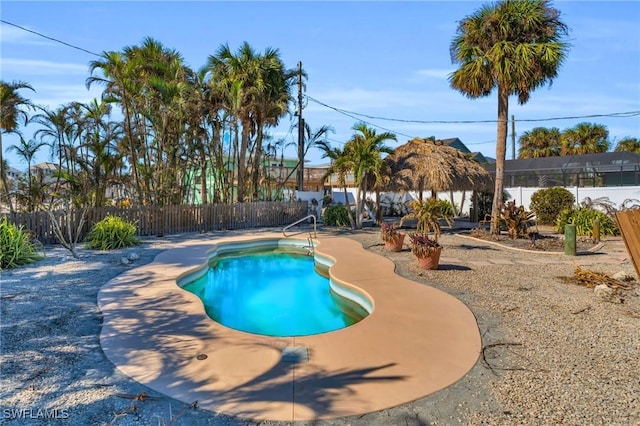 view of swimming pool with a patio, a fenced backyard, and a fenced in pool