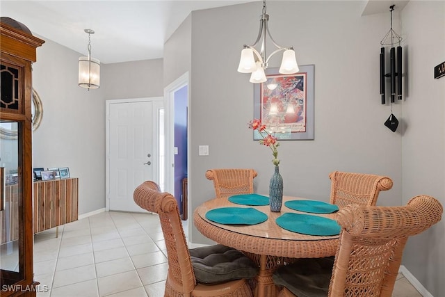 dining room featuring light tile patterned floors and an inviting chandelier