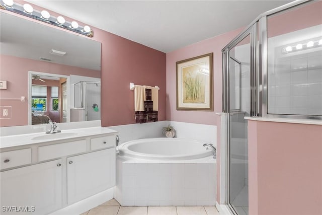 bathroom with separate shower and tub, tile patterned flooring, and vanity