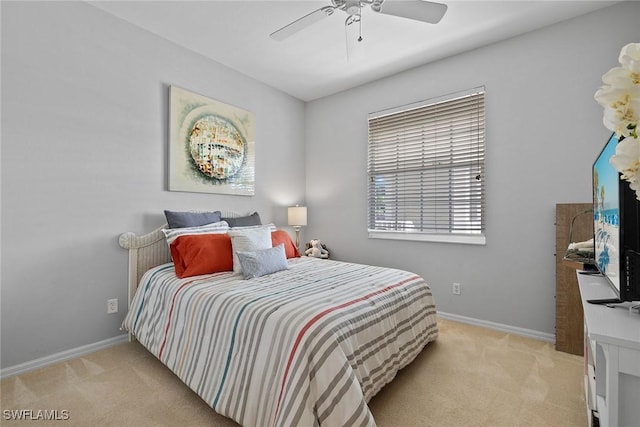 bedroom with ceiling fan and light colored carpet