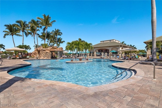 view of swimming pool with a patio area