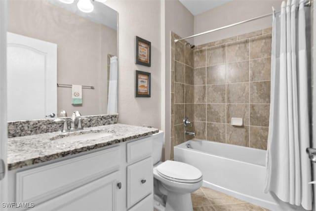 full bathroom with tile patterned flooring, shower / bath combo, toilet, and vanity