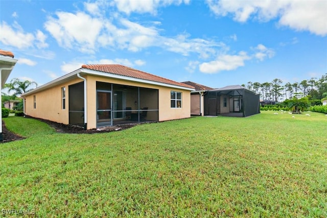 rear view of property with a yard